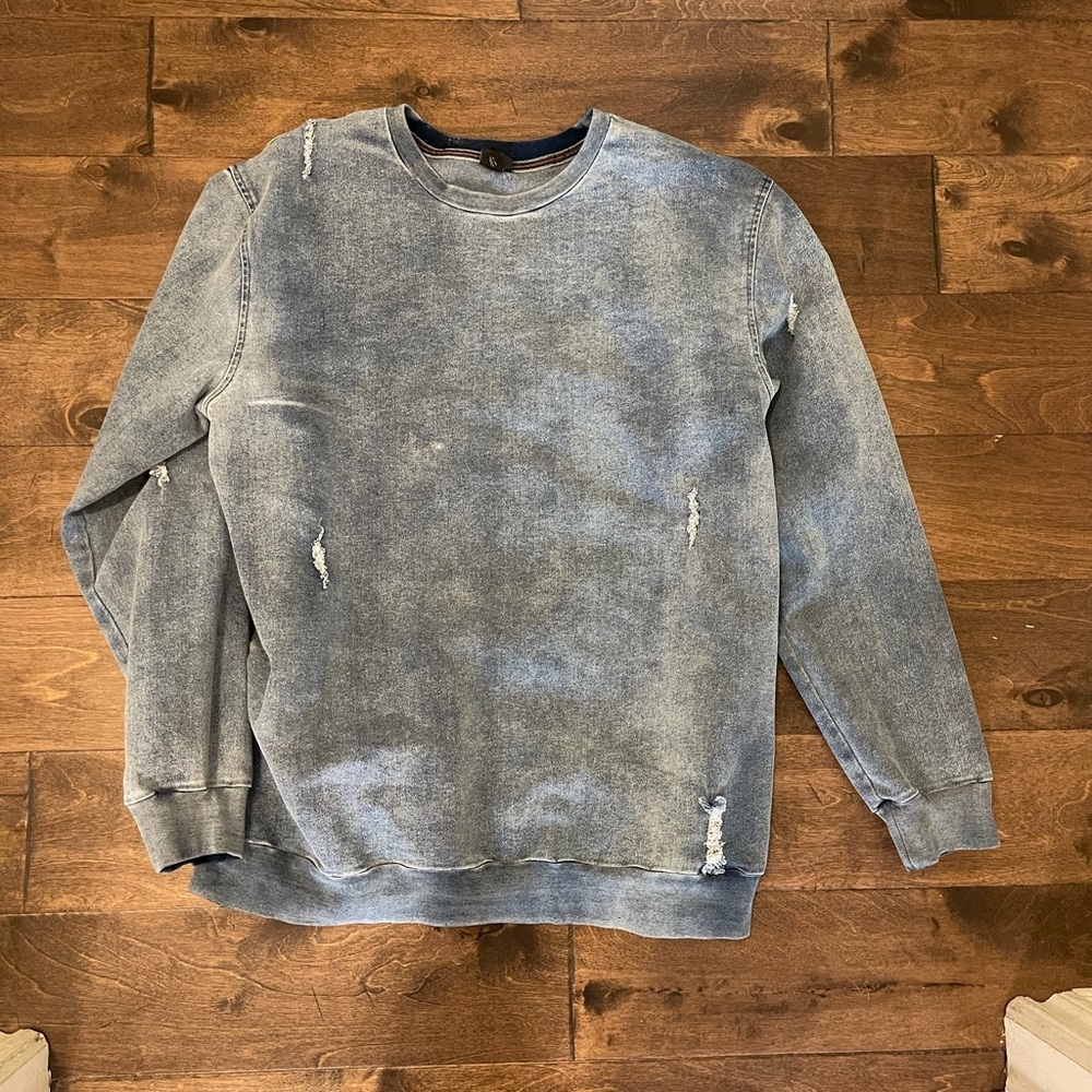 Destroyed denim pullover